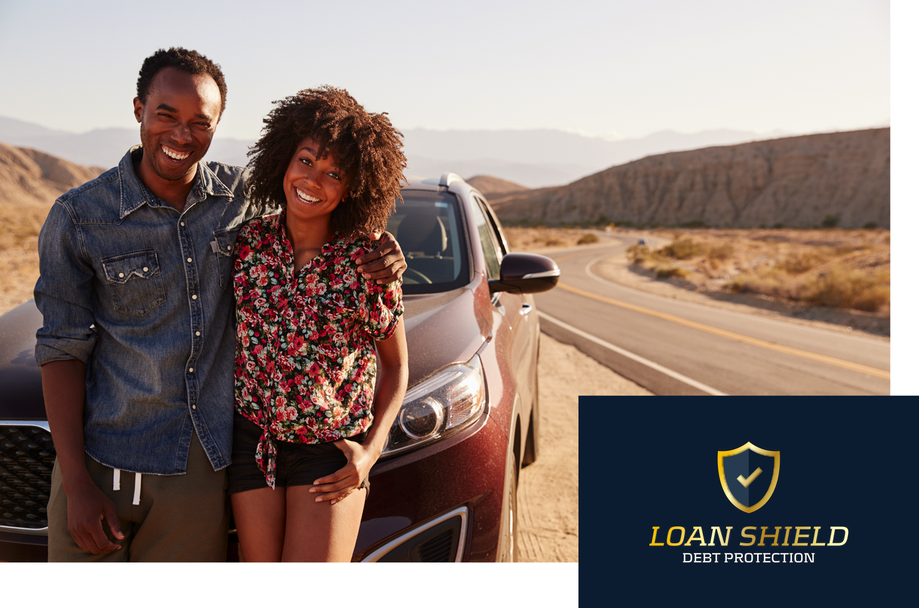 Couple standing by card and Loan Shield logo